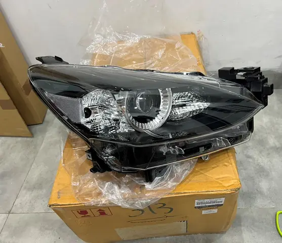 Giá Đèn Pha Mazda 2